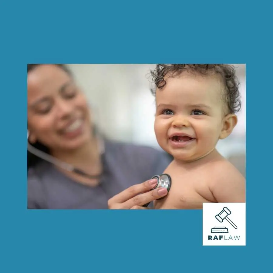 Pediatrician with a stethoscope examining a cheerful baby during a check-up.