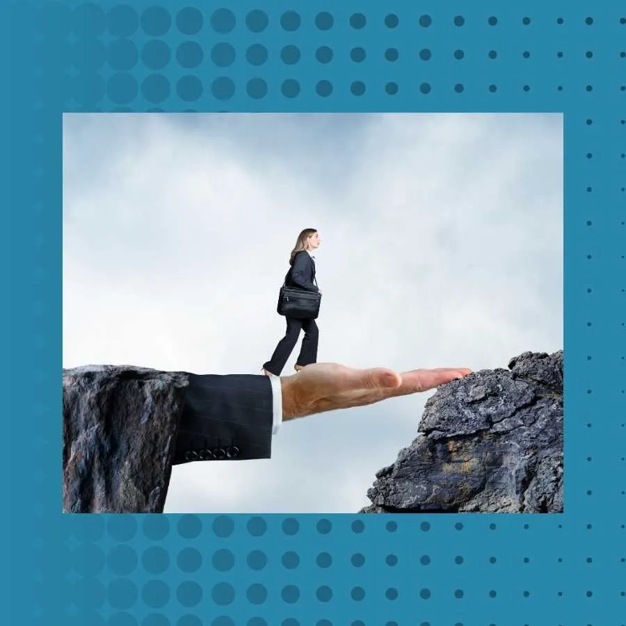 Businesswoman Stepping onto a Giant Hand Bridging a Cliff