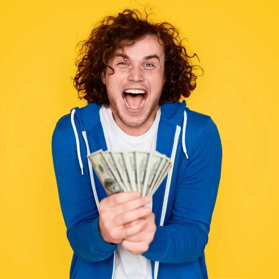 Ecstatic Man Holding Money