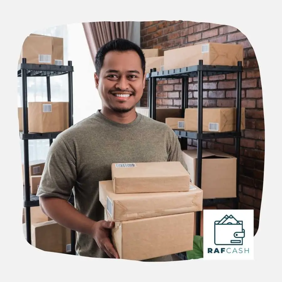 Small Business Owner in a Warehouse Smiling with Packages
