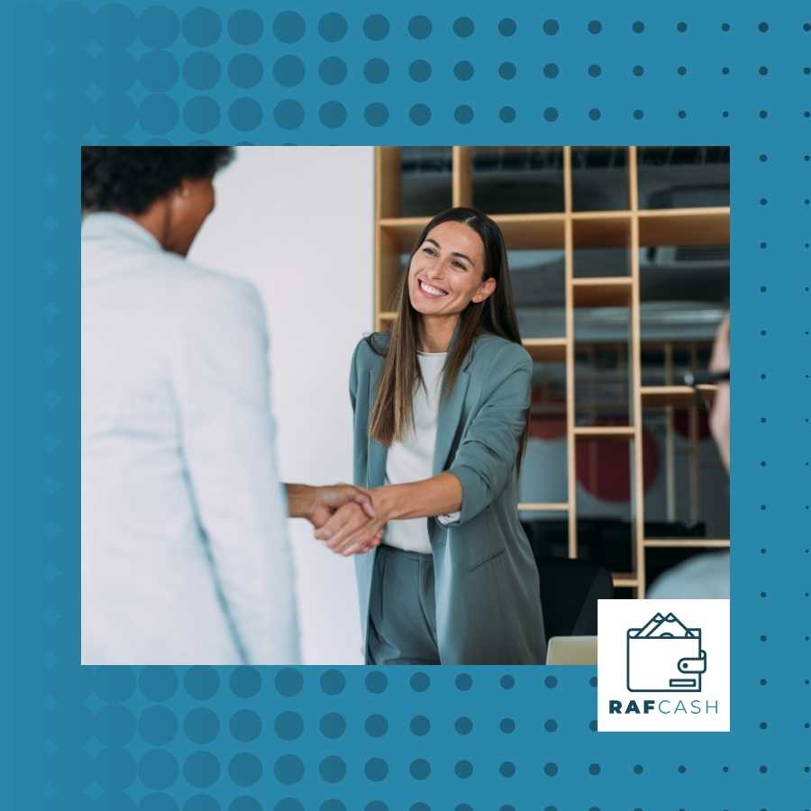 Enthusiastic attorney greeting a client with a handshake in an office environment.