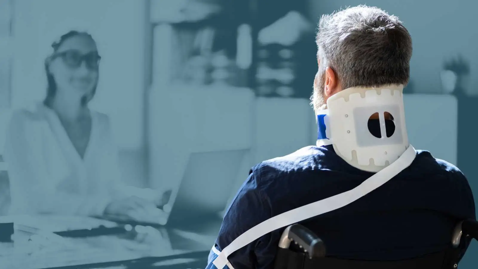 Attorney consulting a client in a neck brace and wheelchair, symbolizing personal injury legal services.