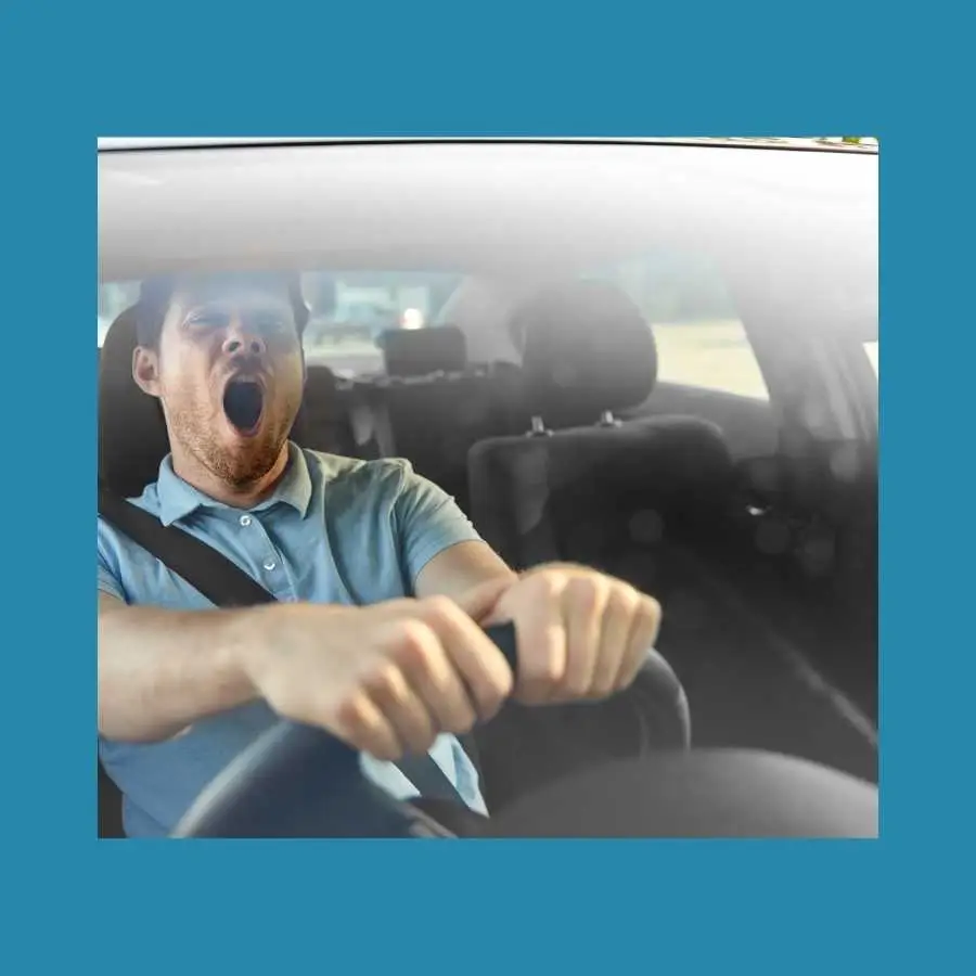 Tired Driver Yawning While Holding Steering Wheel