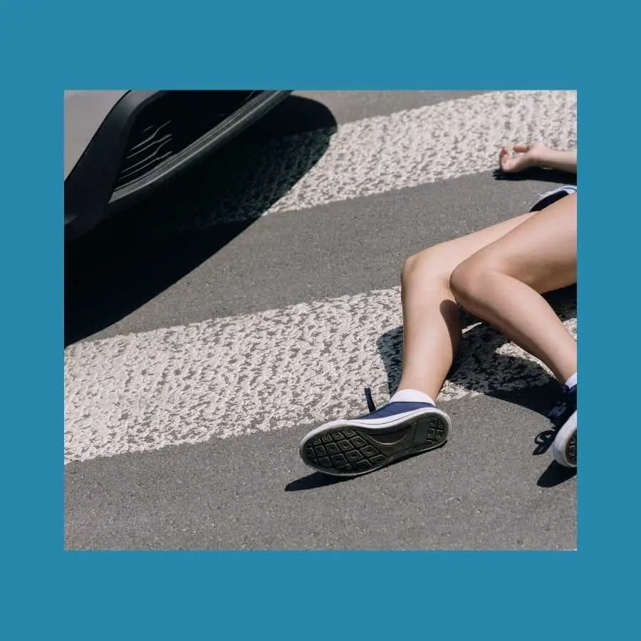 Pedestrian Legs Lying on a Crosswalk After an Accident