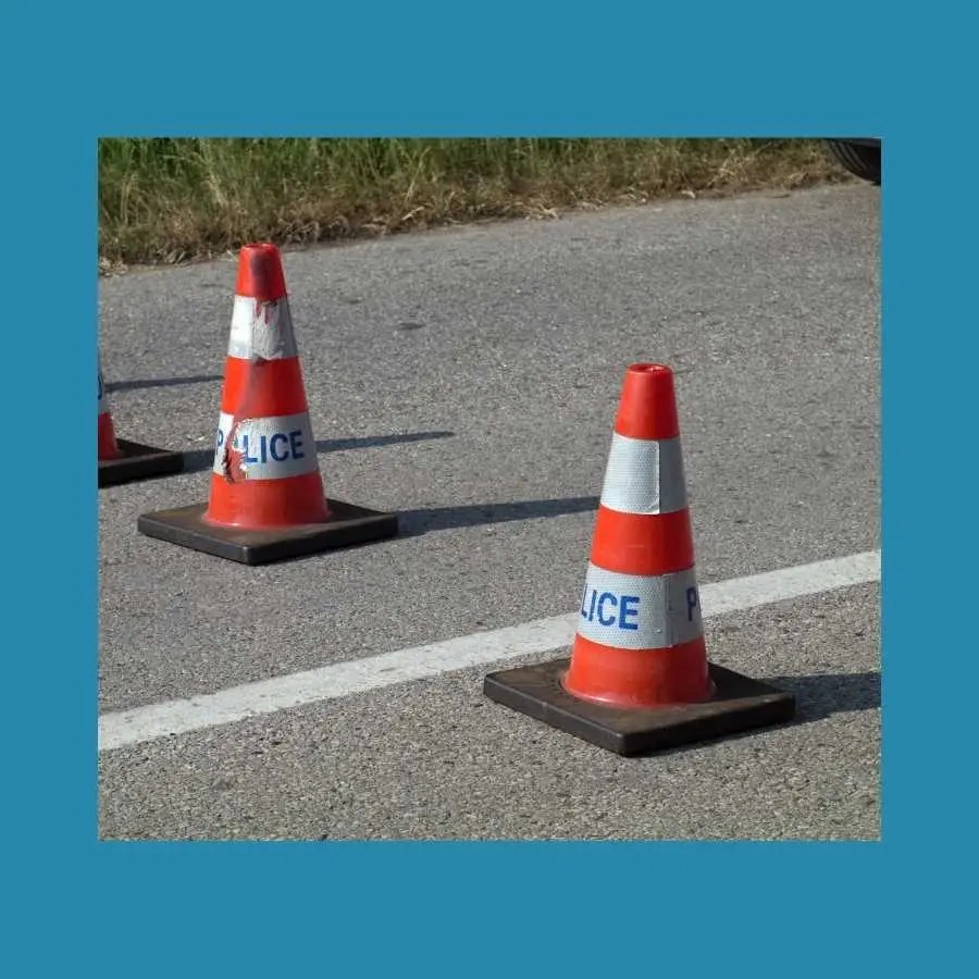 Traffic cones with "POLICE" marking on a road