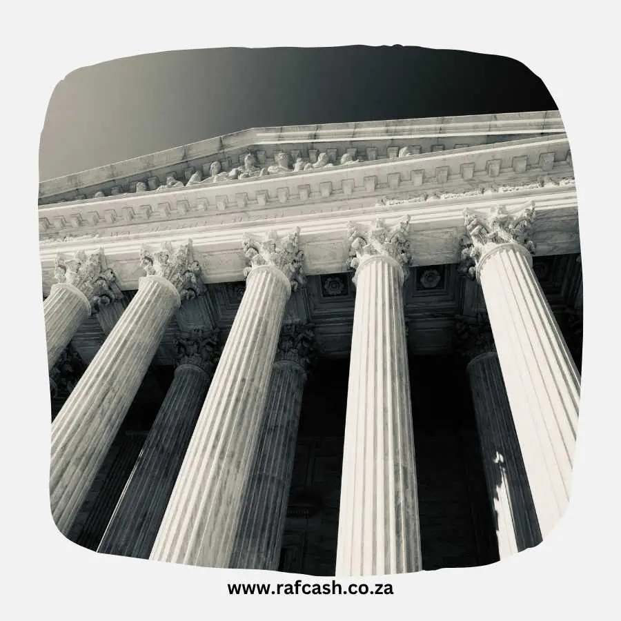 Monochrome image of stately courthouse columns, symbolizing the grandeur and authority of the legal system.