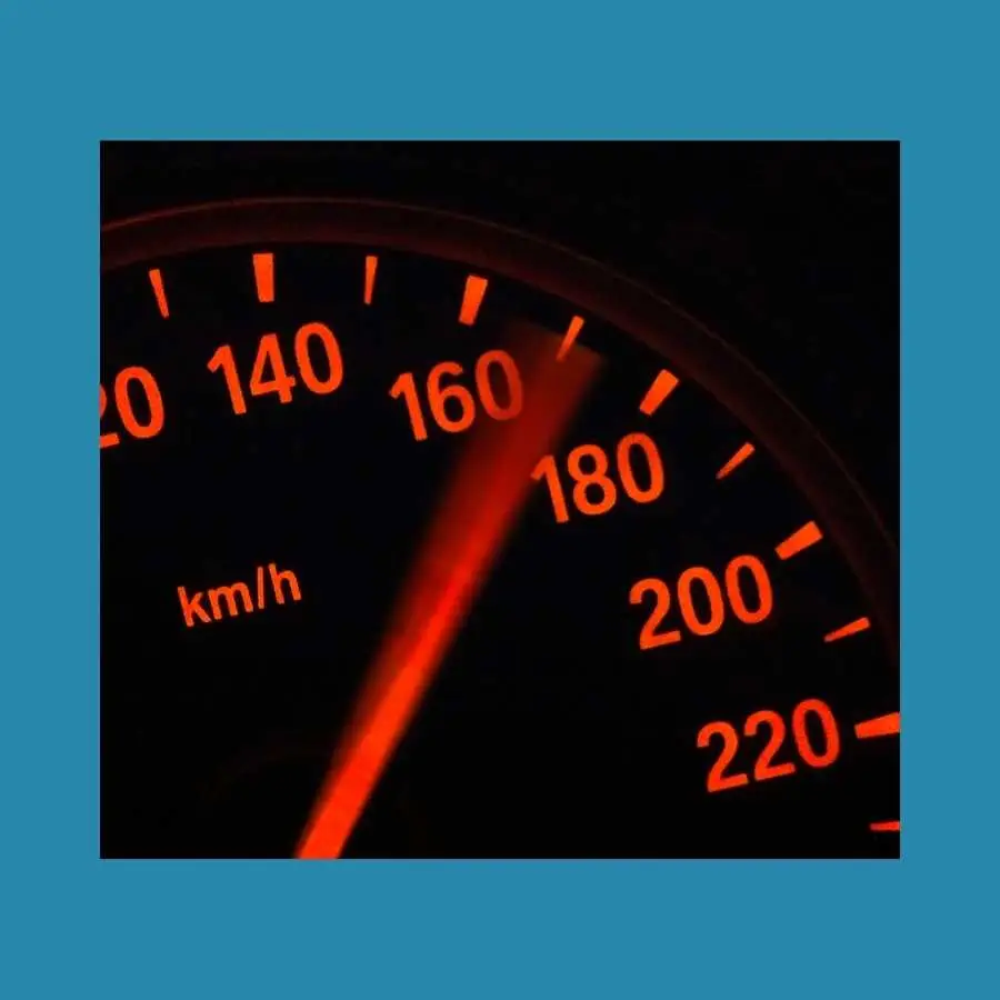 Car Speedometer Indicating High Speed at Night