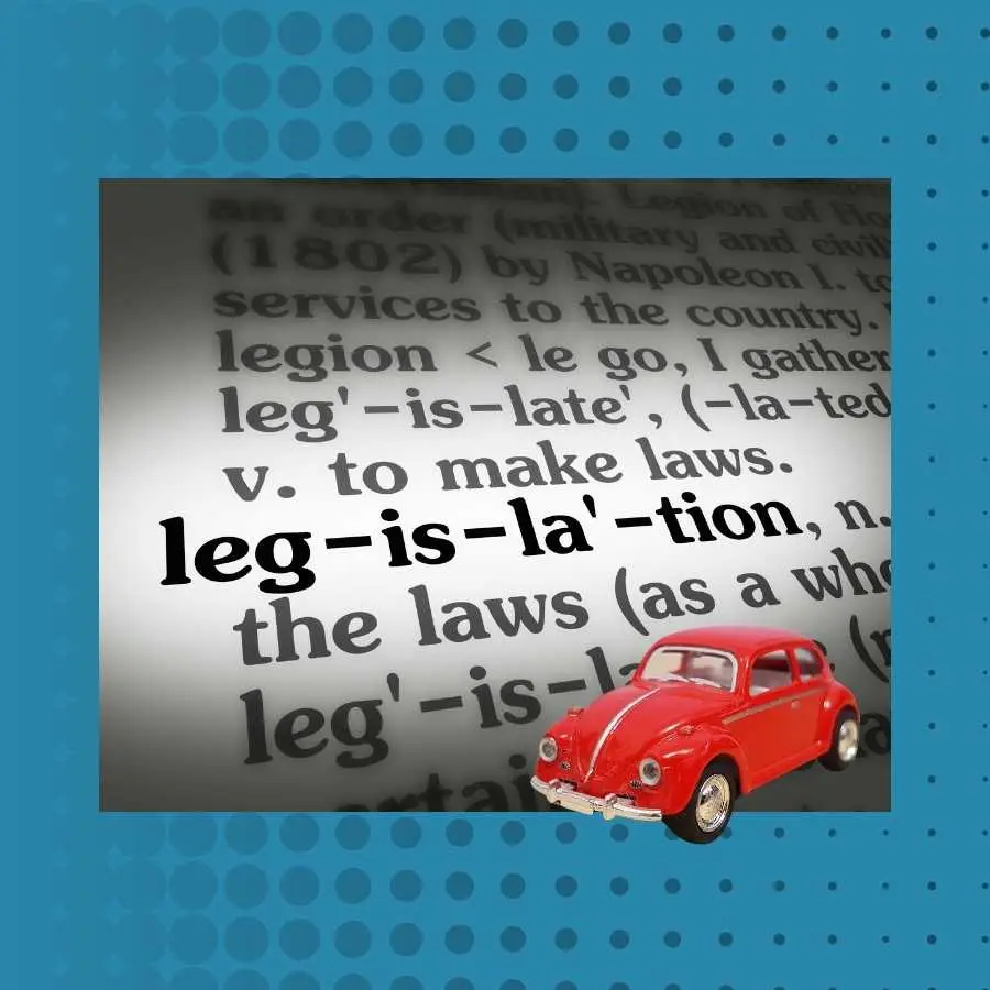 Vintage red car on a dictionary page defining legislation