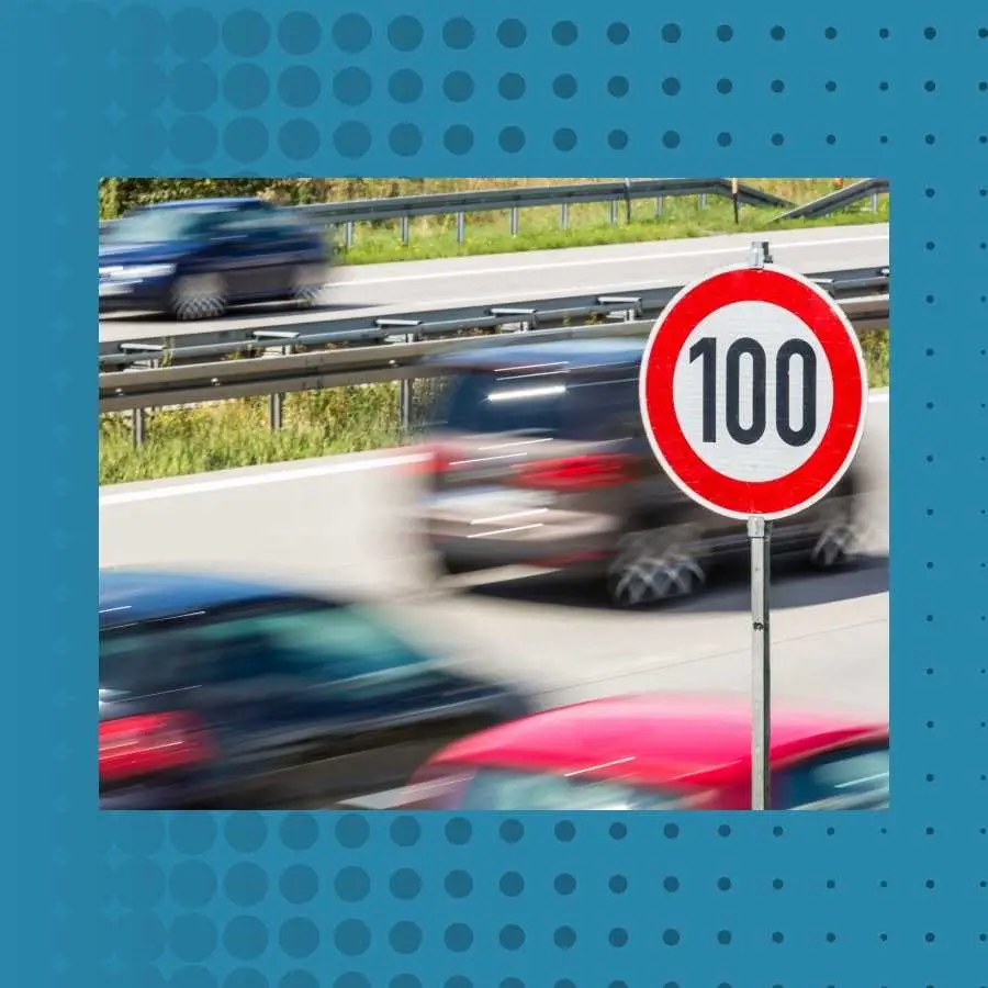 Speed limit sign of 100 km/h with blurred cars in motion