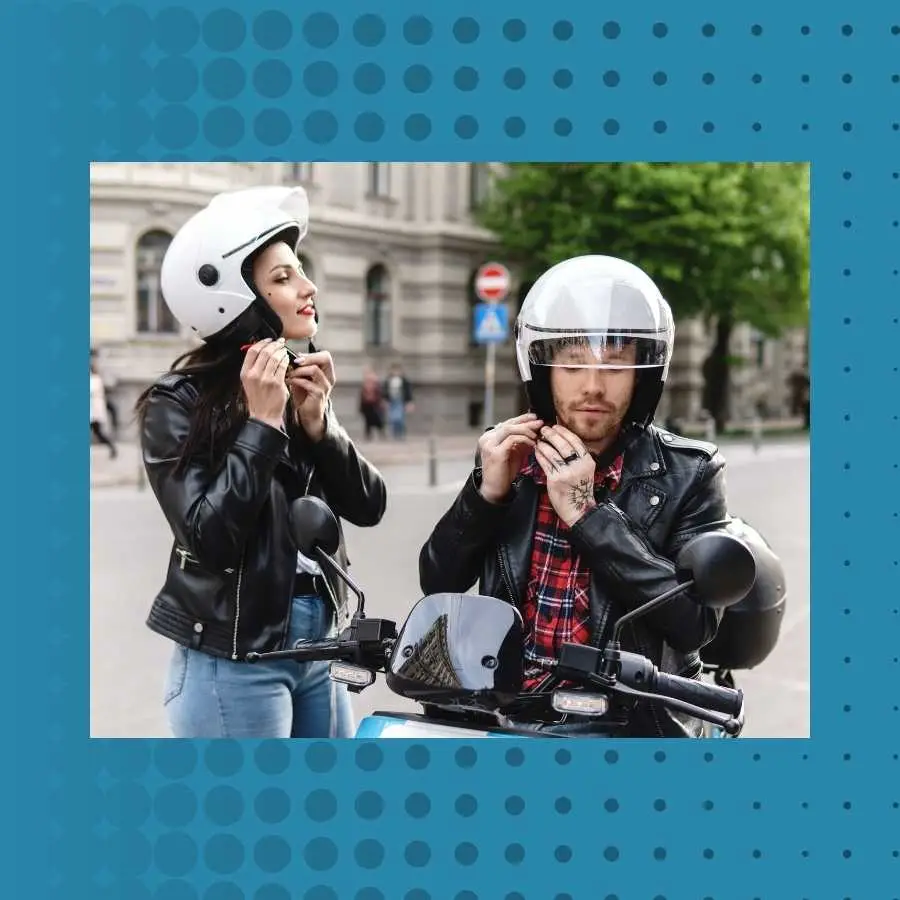 Two motorcyclists putting on helmets before riding