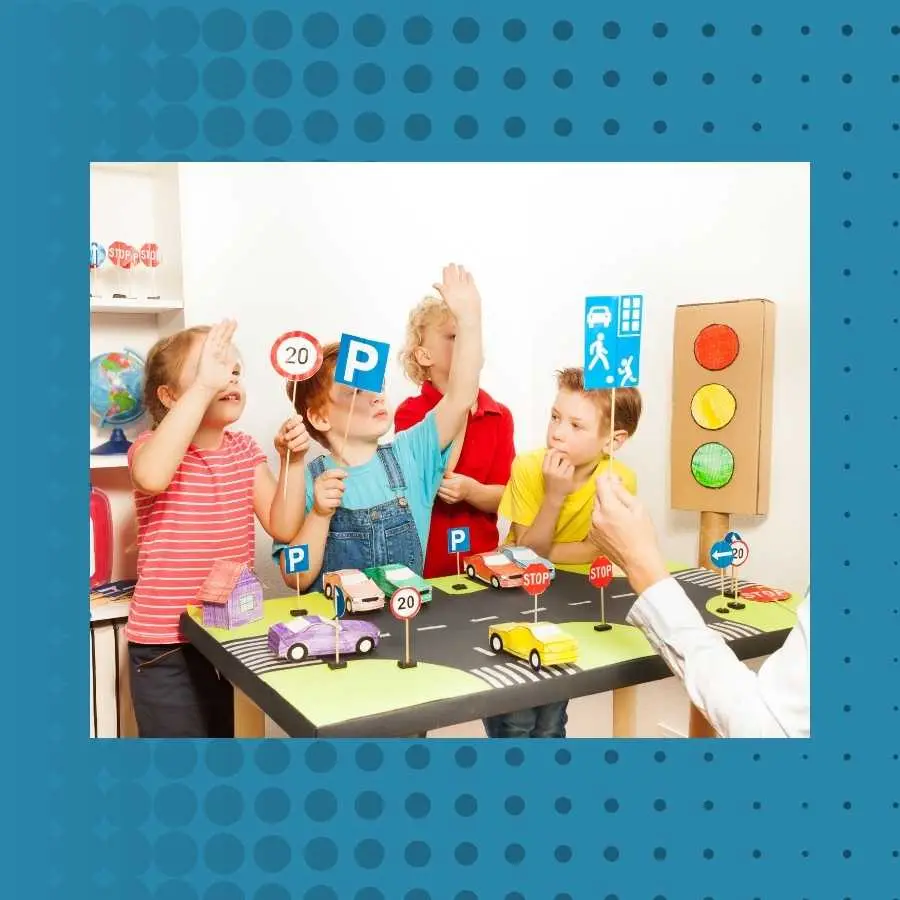 Children in a classroom learning road safety with traffic signs