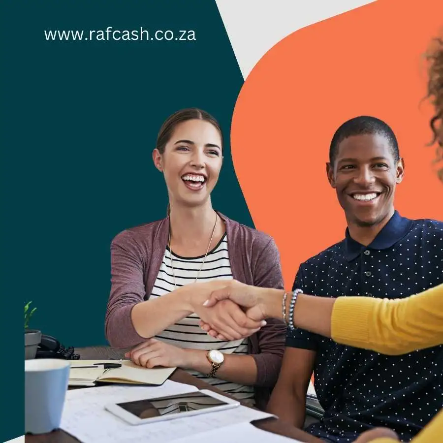 Smiling woman and man shaking hands at a meeting with RAF Cash website in the background