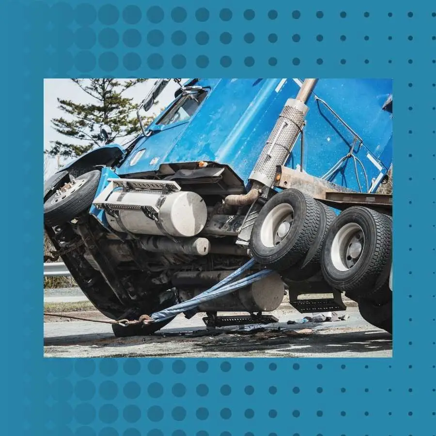 Wreckage of a blue truck involved in a road accident