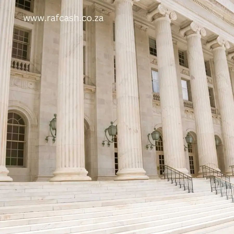 Stately white marble columns of a neoclassical courthouse facade