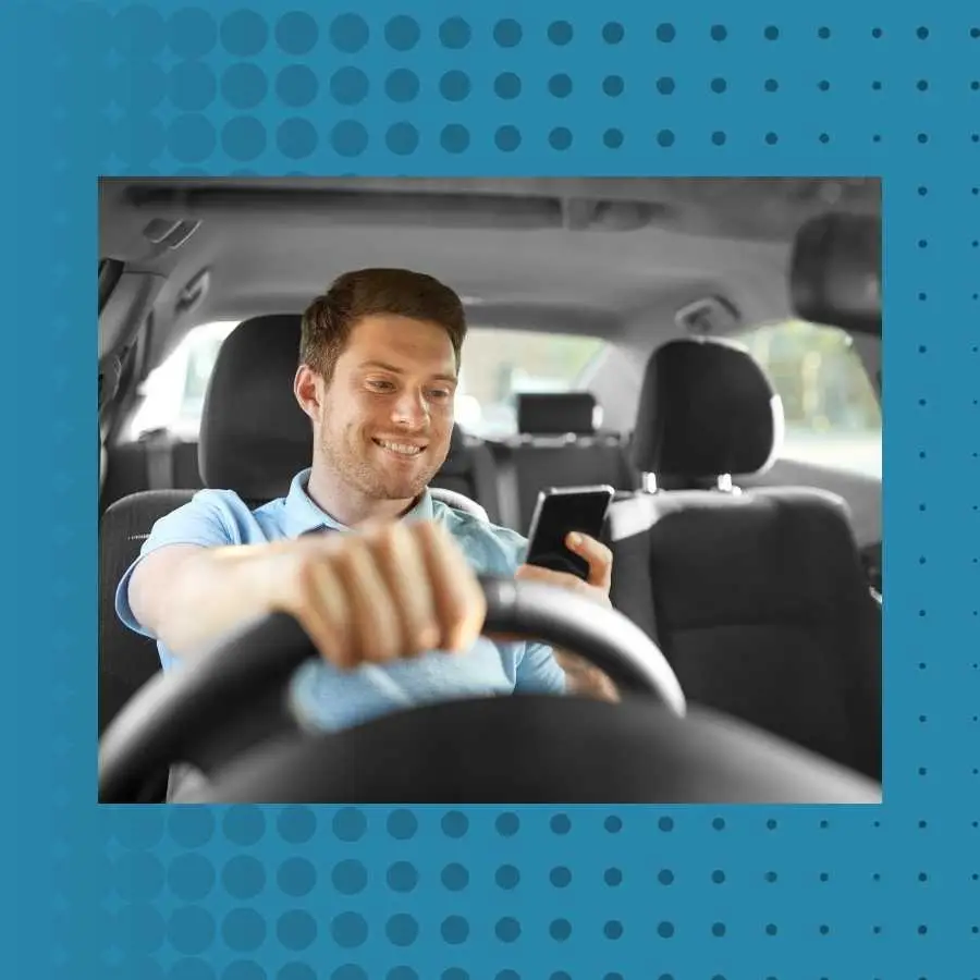 Man using smartphone while driving, highlighting distracted driving