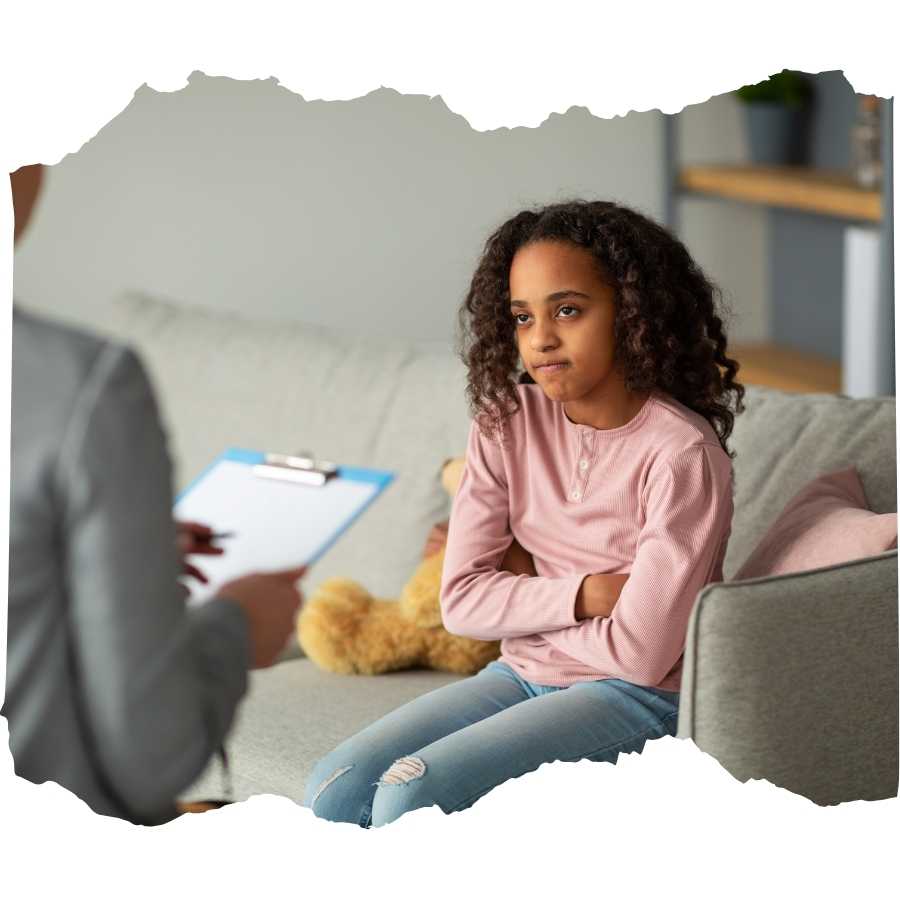 Young girl looking pensive during a session with a psychologist