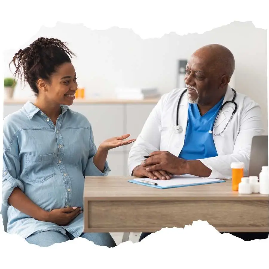 Woman discussing her health with a senior male doctor in a clinic