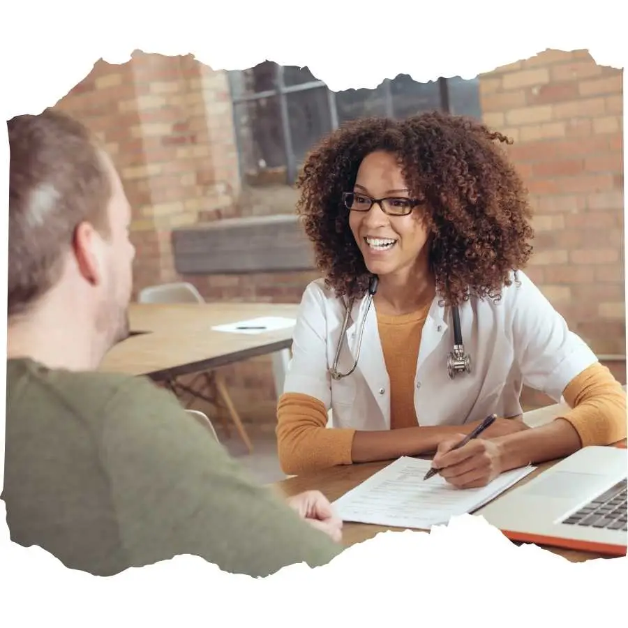 Cheerful doctor consulting with a patient in an informal office setting