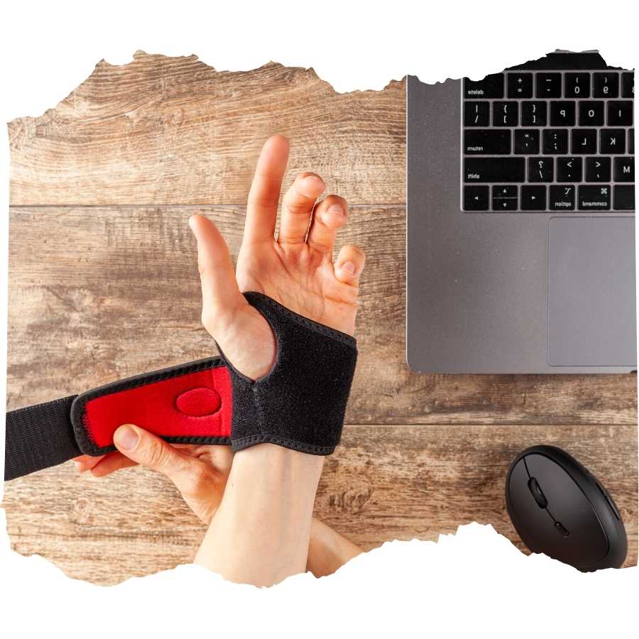 Hand wearing an ergonomic wrist brace near a laptop and mouse