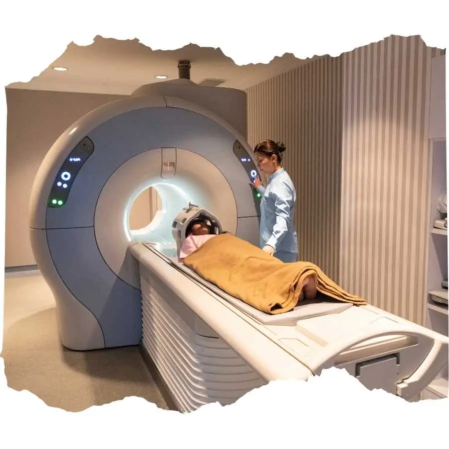 Medical professional operating an MRI machine with a patient undergoing a scan