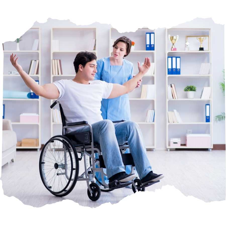 Young man in wheelchair performing physical therapy exercises with therapist's assistance