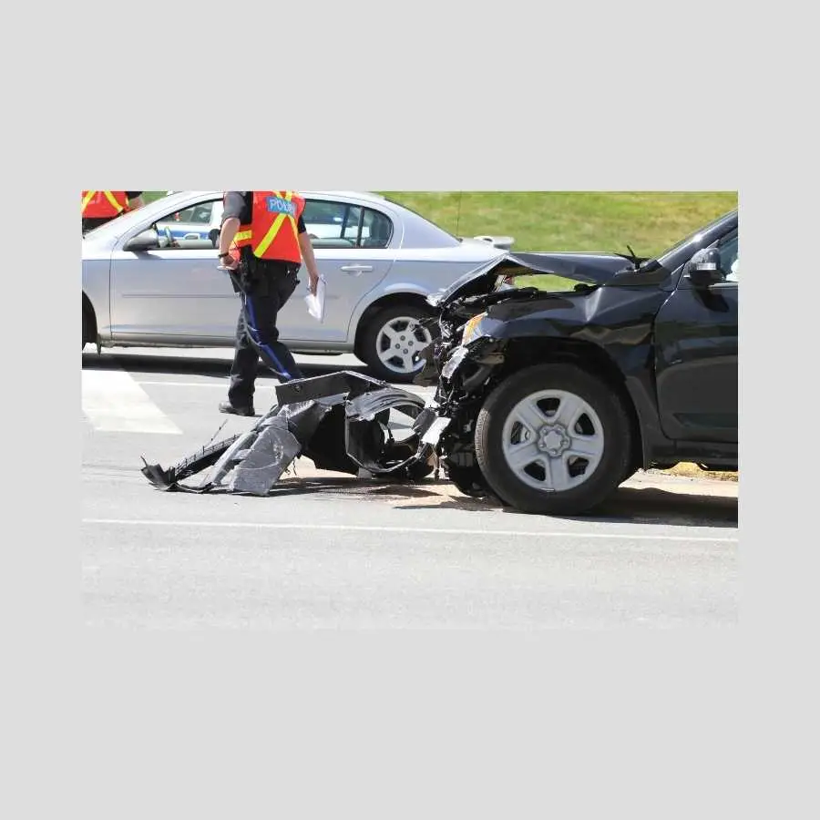 Road traffic accident scene with police officer and damaged vehicles in South Africa