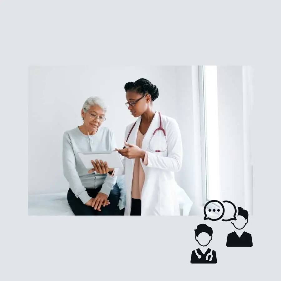 Doctor showing medical information on a tablet to an elderly female patient