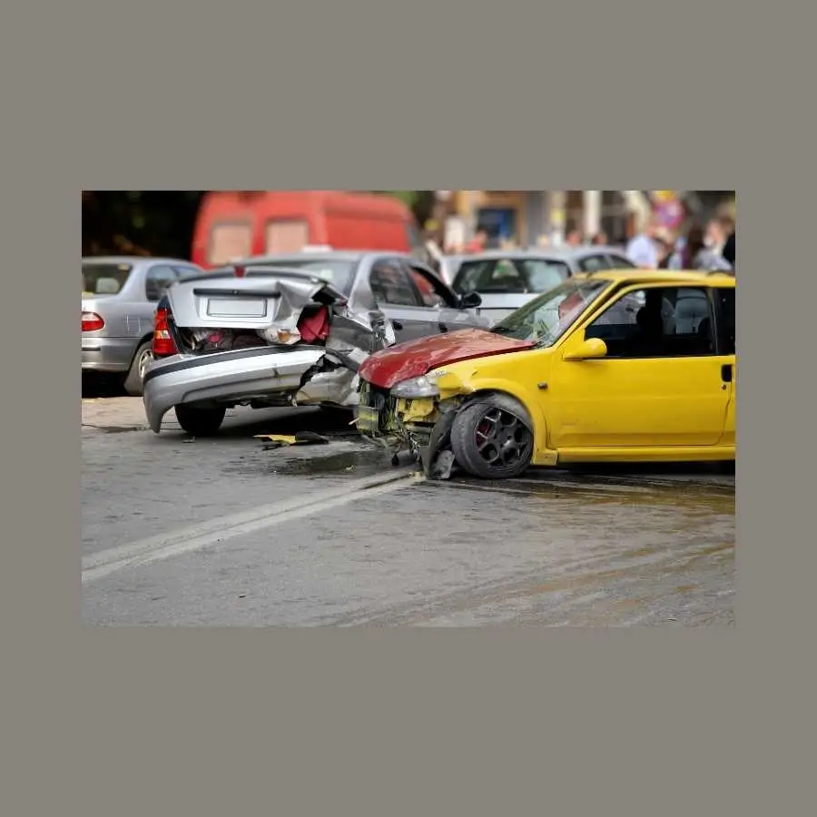 Multiple car accident on a city street with visible damage