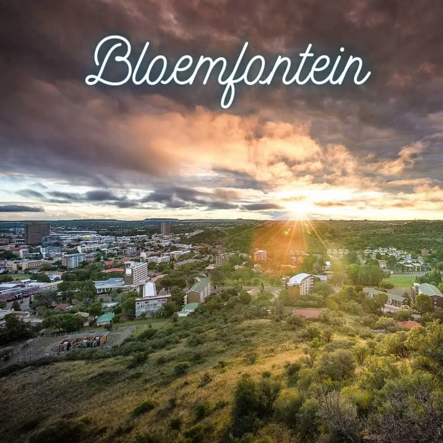 Aerial view of Bloemfontein at sunset showcasing the cityscape and natural surroundings