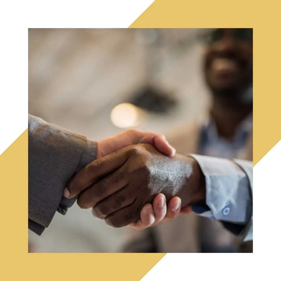 Close-up of a handshake, symbolizing settlement agreement and trust in RAF claims process