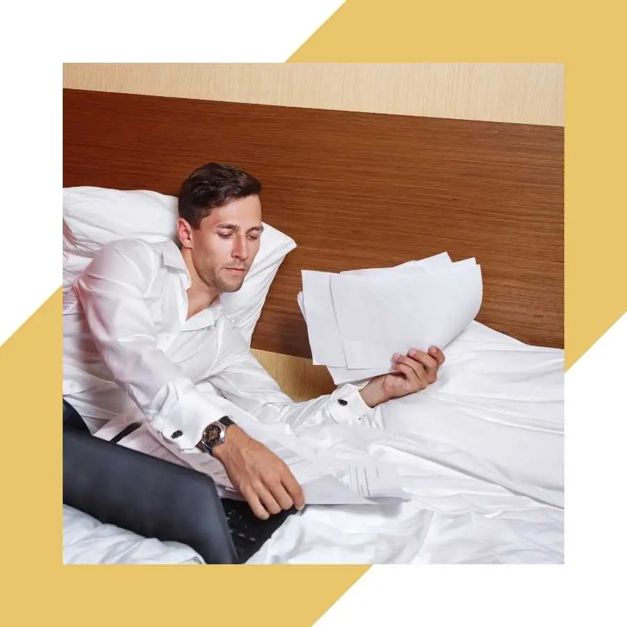 Man reviewing documents in bed, emphasizing the importance of timely RAF claims