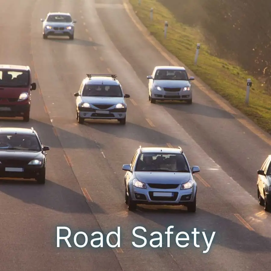 Multiple cars driving on a highway during daytime emphasizing road safety