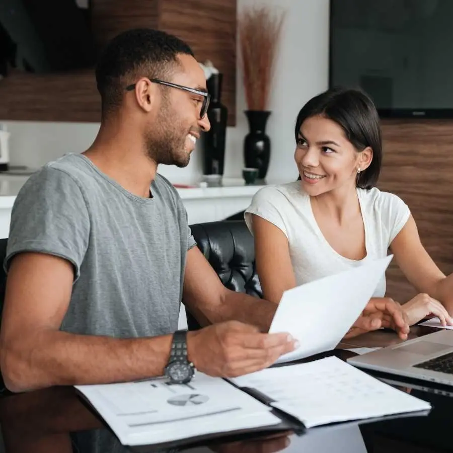 Couple discussing bridging finance options at home